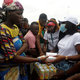Demonstrators queue up to receive food during a EndSARS protest over police brutality in Lagos, Nigeria. Oct. 16, 2020.